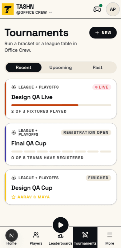 The foosball tournaments list in Tashn: recent, upcoming and past competitions, each card edged in its own accent and flagged live, open for registration, or finished.